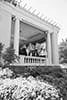Group of people on a porch of a large building