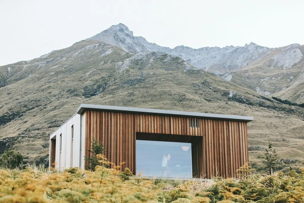 Modern wooden cabin in a mountainous landscape