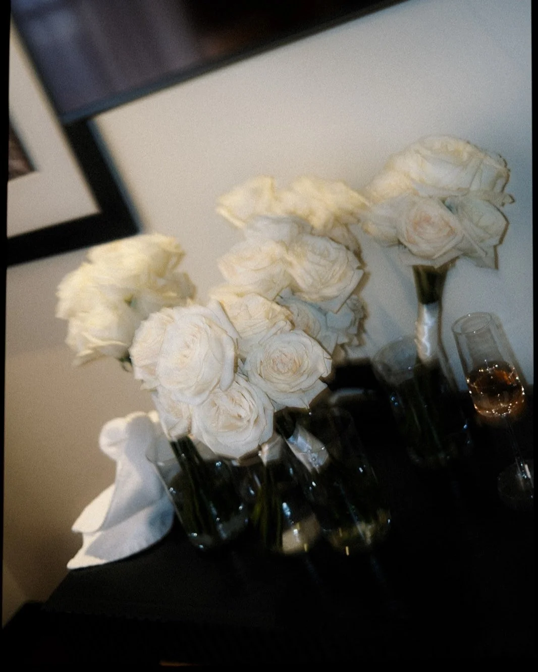 Film photos of single white roses for bridesmaids, by Laura Powers Photo