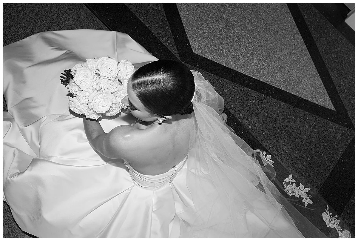 Flash photo of chic high fashion editorial bride with slicked back hair at the Mayo Hotel in Oklahoma, Laura Powers Photo