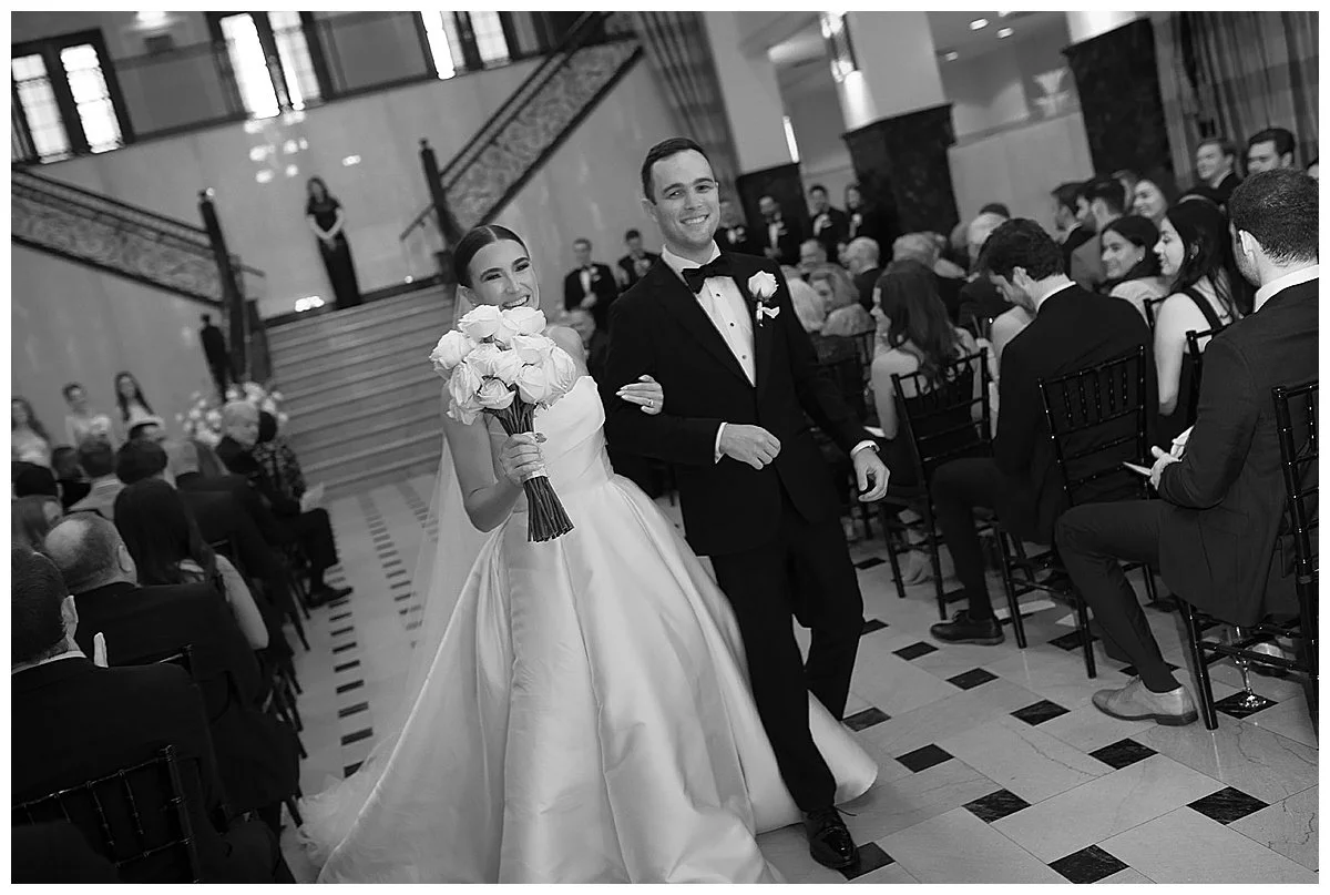 Classic timeless wedding with couple walking down the aisle at wedding ceremony at the Mayo Hotel in Oklahoma, Laura Powers Photo