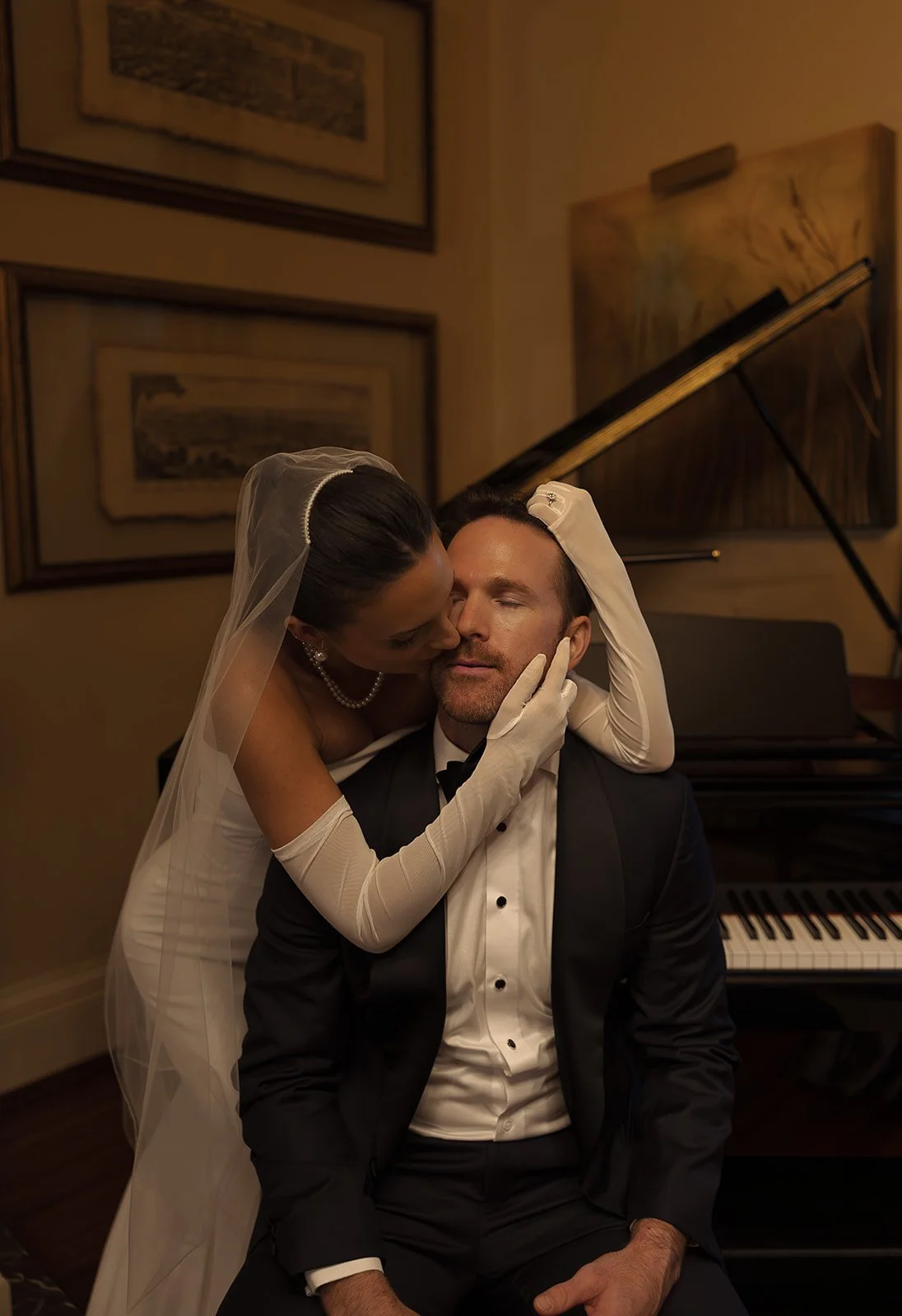 Beautiful wedding photo of bride with gloves and groom in tux, Laura Powers Photo